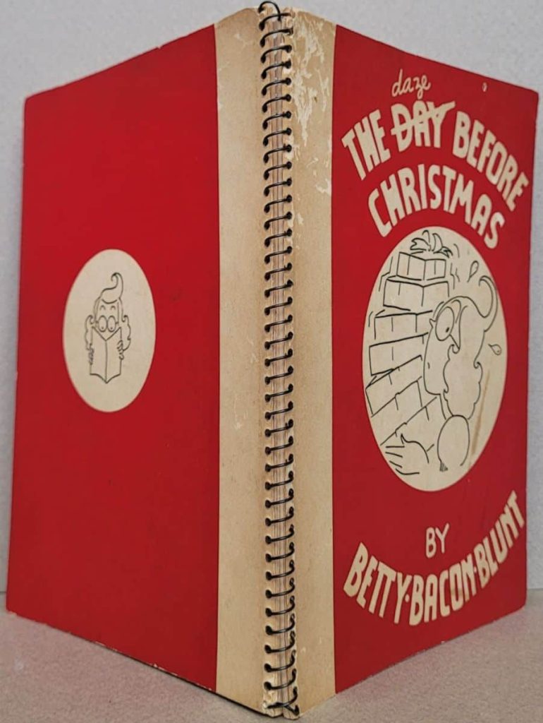 The front and back cover of Betty Bacon Blunt’s wordless novel, The Day Before Christmas, showing the wire spiral spine.