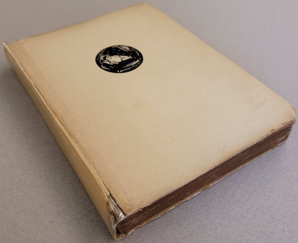 Front cover of Bochořáková’s 1930 novel, Kindheit, showing the medallion of a baby.