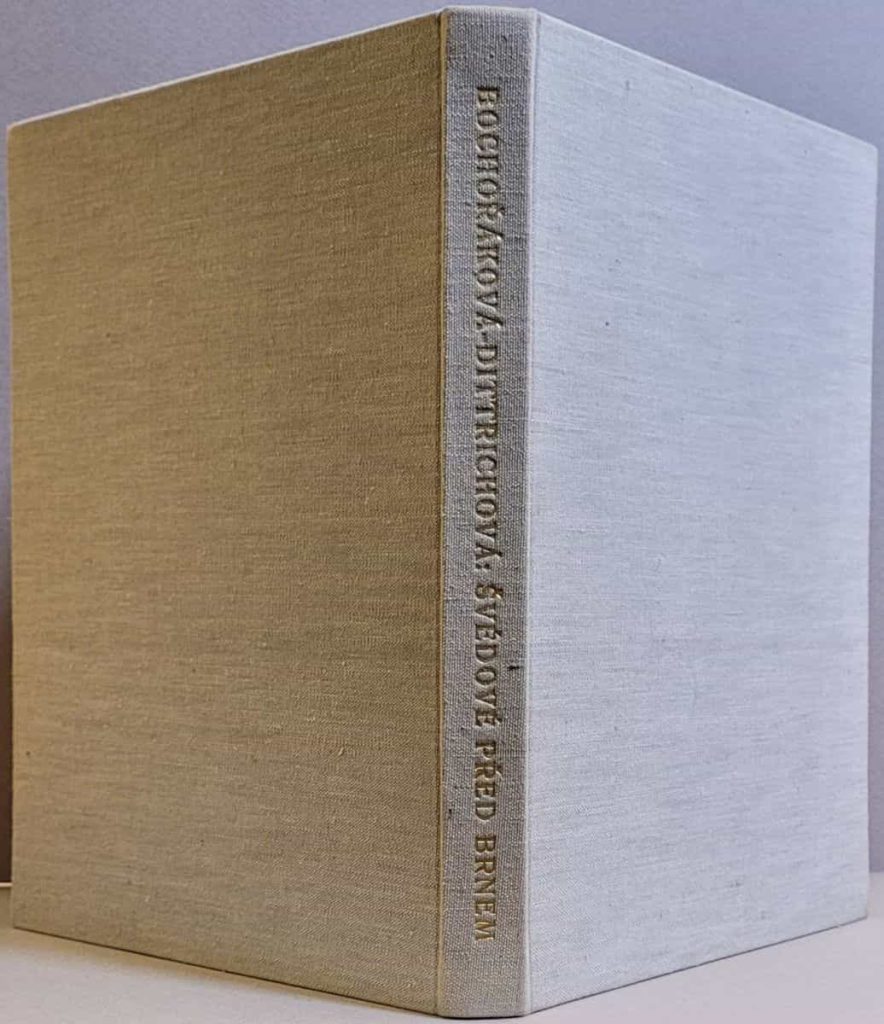 The cloth boards and gold-titled spine of the limited edition (90 copies) of Bochoráková's wordless novel, Švédové Pred Brnem,.
