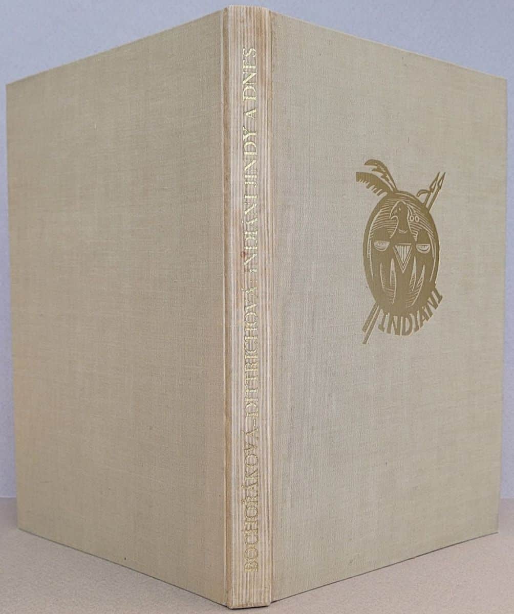 Cloth cover of Indiáni Jindy a Dnes with gold title
on the spine and a stylized shield on the front cover.