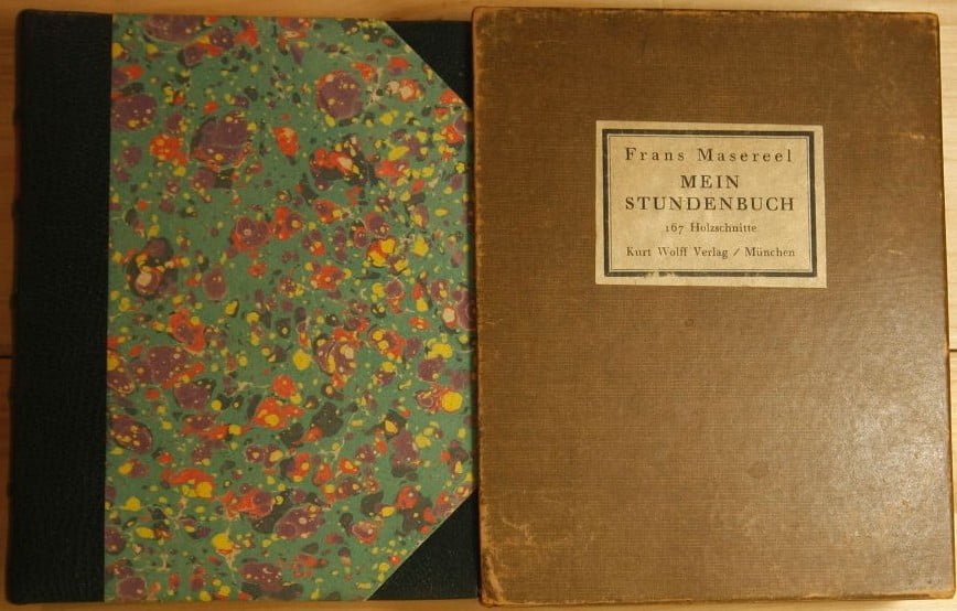 Masereel's 1920 wordless novel, Mein Stundenbuch, in black 3/4 leather with bluish marbled boards and a slipcase.